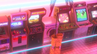 A row of arcade machines bathed in a Miami-style pink and neon blue light. I should like to live there.
