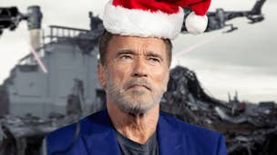 Arnold Schwarzenegger is stood scowling, a Santa hat photoshopped into his head. A scene from the Terminator of a ruined building can be seen in the background.