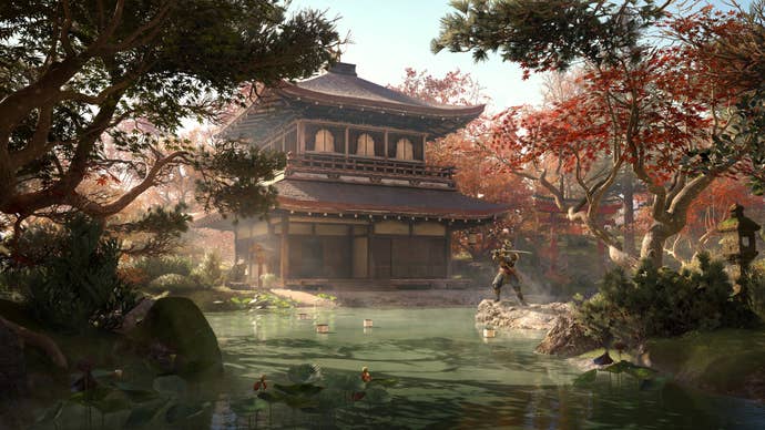Yasuke stands in the middle of a Japanese garden outside of a pagoda in Assassin’s Creed Shadows.