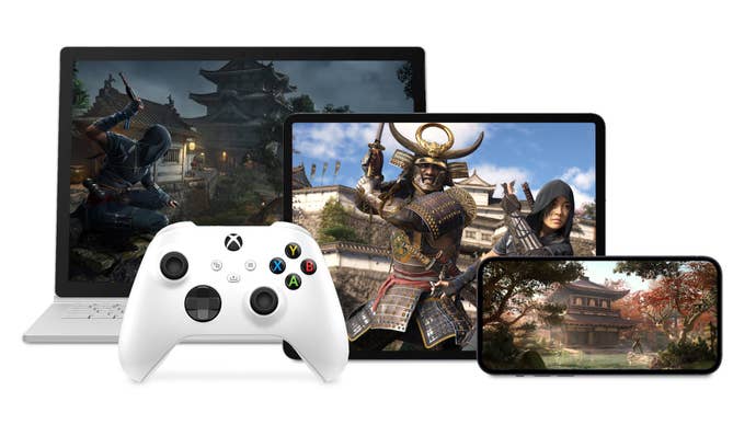 Images from Assassin’s Creed Shadows displayed on a laptop screen, tablet, and phone, with an Xbox controller nearby.