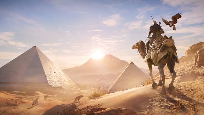 Bayek rides a camel while looking at the Pyramids in Assassin’s Creed Origins
