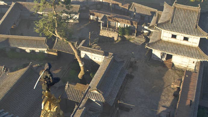 assassin’s creed shadows naoe on roof looking over osaka castle