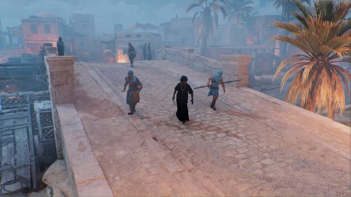 assassins creed mirage a tha'abeen and two guards walk across a bridge in Anbar