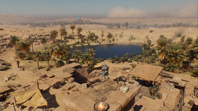 assassins creed mirage basim crouching on roof overlooking northern oasis