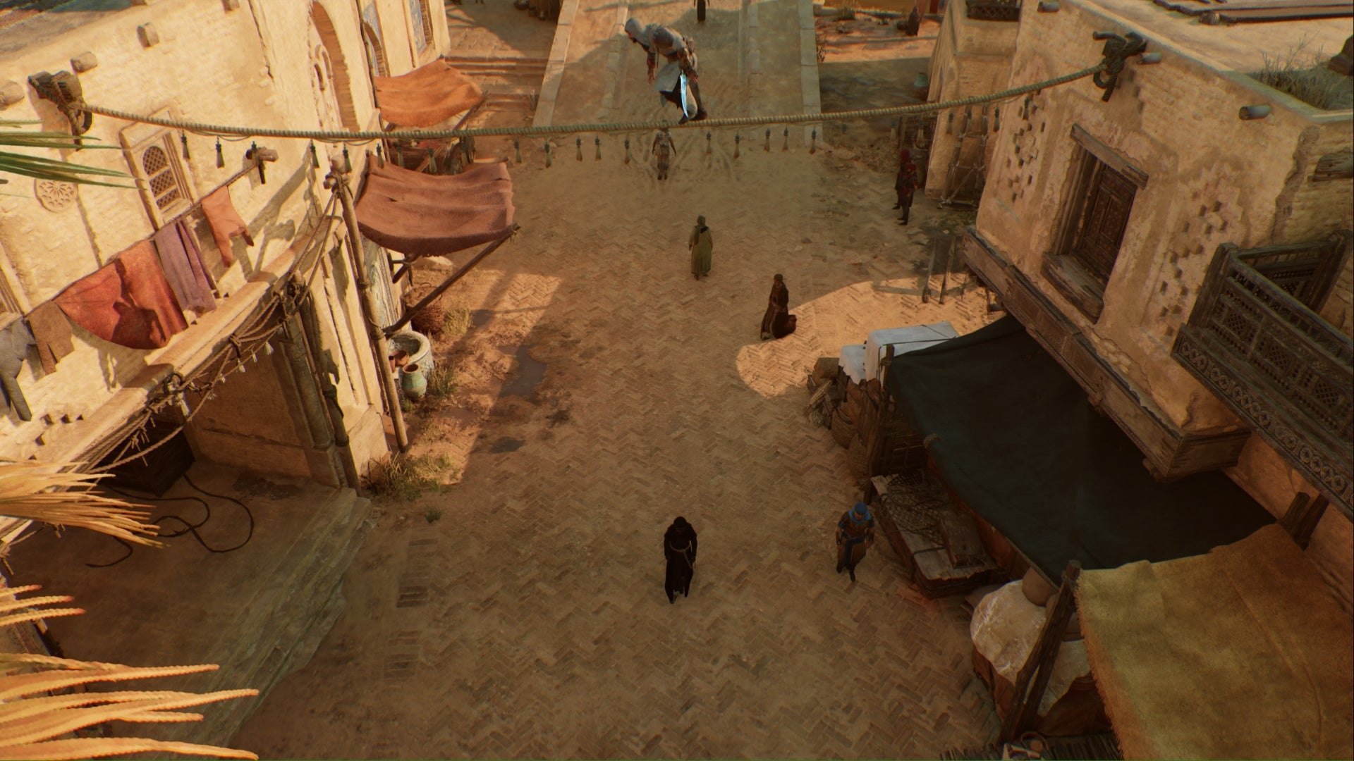 assassins creed mirage basim on rope above tha&rsquo;abeen target in karkh