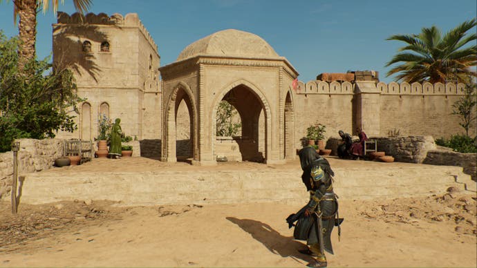 assassins creed mirage, Basim is heading towards a stone dome in the graveyard.