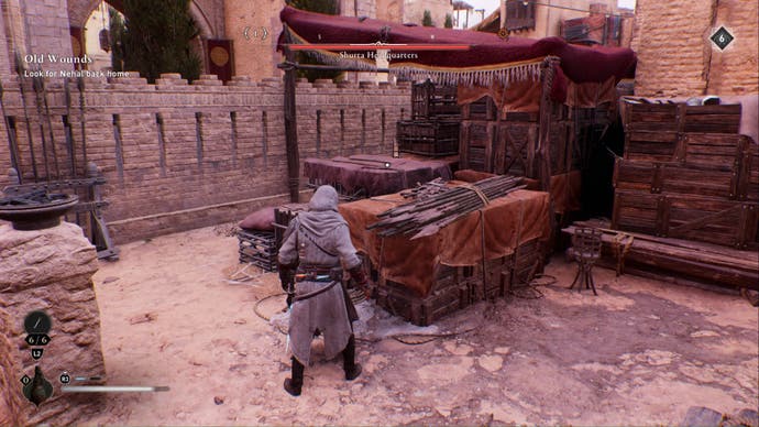 assassins creed mirage, Basim is looking at a stack of crates in a courtyard in a restricted area.