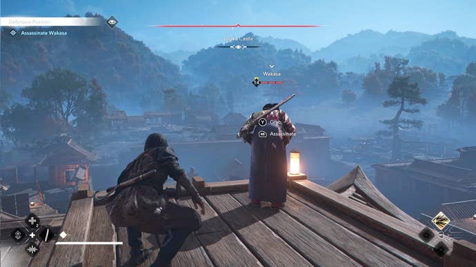 Naoe in Assassin’s Creed Shadows sneaks up behind Wakasa atop a building rooftop while Wakasa looks over the edge to her soldiers below.