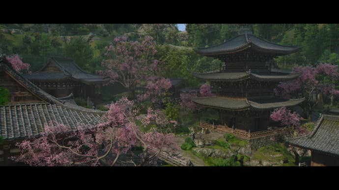 A view of blooming sakura and a traditional pagoda in Spring in Assassin’s Creed Shadows.