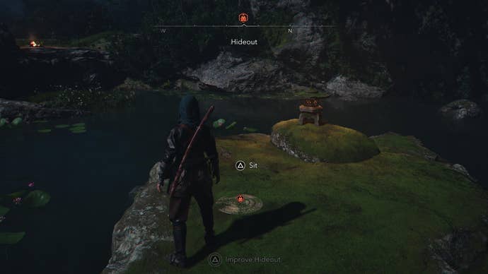 Standing at the Hideout Kuji-kiri shrine in Assassin’s Creed Shadows, which is located on a rocky island in the middle of a pond.