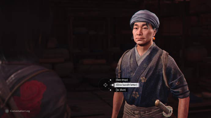 Naoe speaking to the Iron Hand Guild merchant, Kin-no-suke, in Assassin’s Creed Shadows.