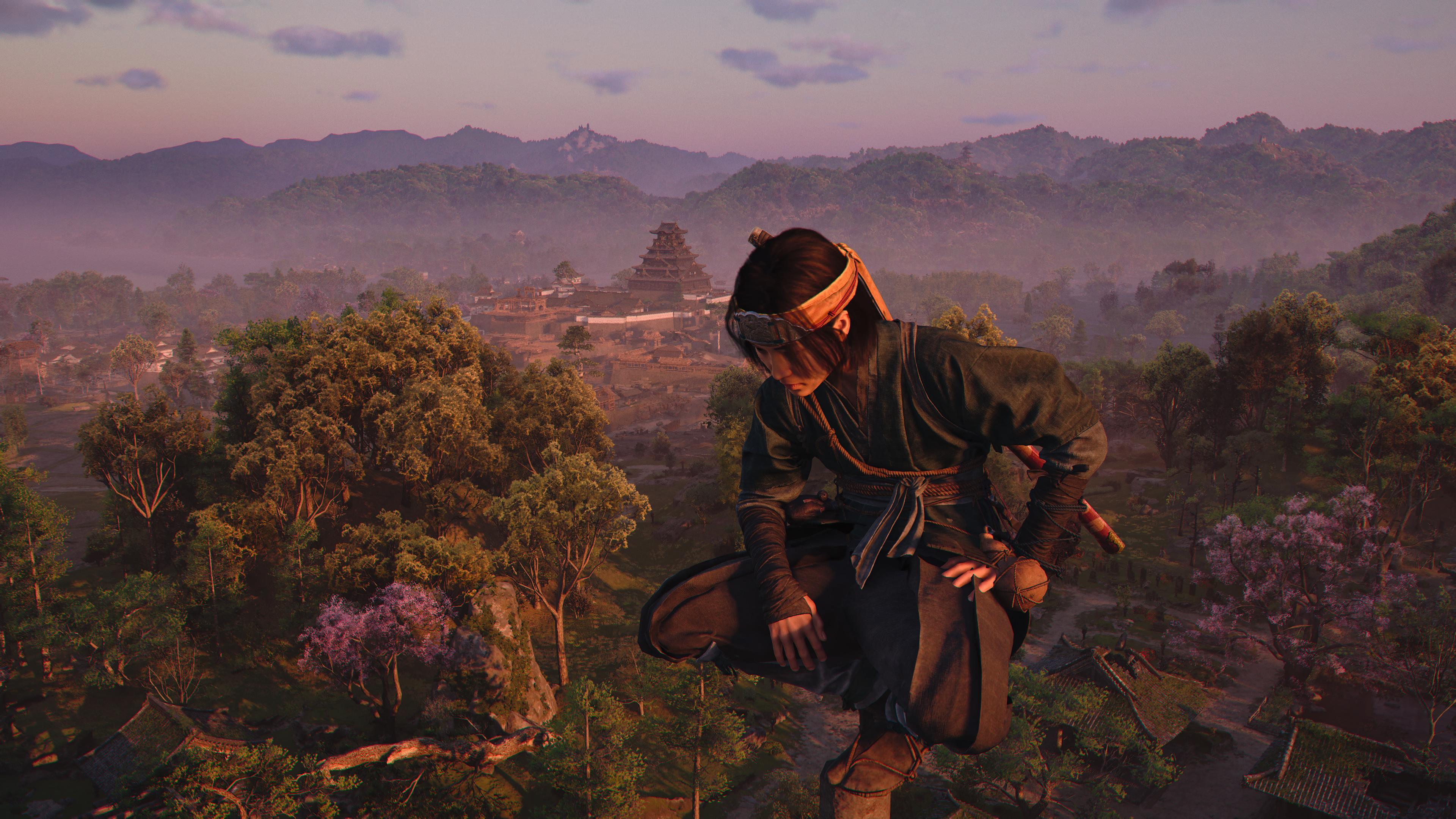 Naoe perched on top of a pagoda in Assassin's Creed Shadows.