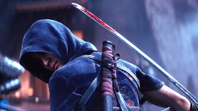 A close-up of Naoe, one of the Assassin’s Creed Shadows protagonists, with her back to the camera holding a blade in her backhand.