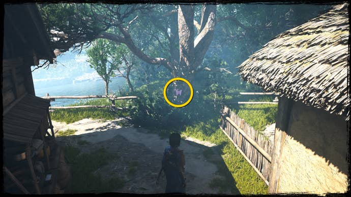 A close-up of a tree in Osaka in Assassin’s Creed Shadows, with a yellow circle highlighting the location of a pink Origami Butterfly.
