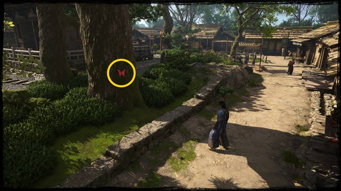 A close-up of a tree in Osaka in Assassin’s Creed Shadows, with a yellow circle highlighting the location of a red Origami Butterfly.
