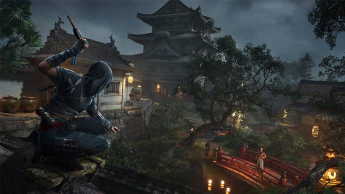 Naoe in Assassin’s Creed Shadows, surveying an area in Feudal Japan she is about to sneak into.