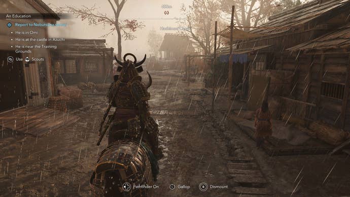 Yasuke on horseback traveling through a town street in the rain.