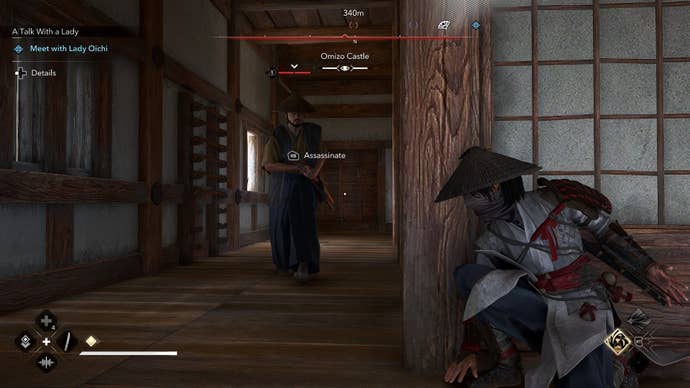 Naoe hides behind a corner in the tenshu of a castle, ready to assassinate an approaching enemy guard.