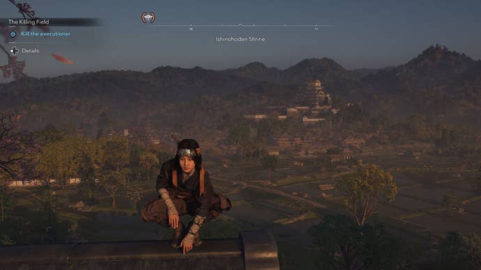 Naoe balances on a rooftop with a sweeping vista of the countryside and distant castle.