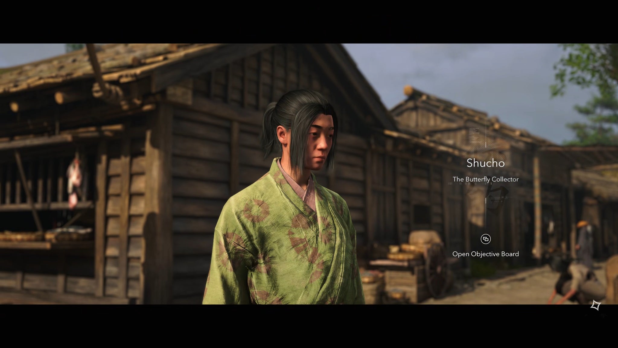 A close-up of Shucho, a kidnapper and member of the Butterfly Collectors in Assassin's Creed Shadows, standing outside a wooden building in Osaka. - 15