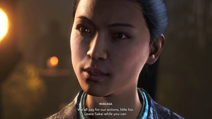 A close-up of Wakasa’s face in Assassin’s Creed Shadows as she threatens Naoe.