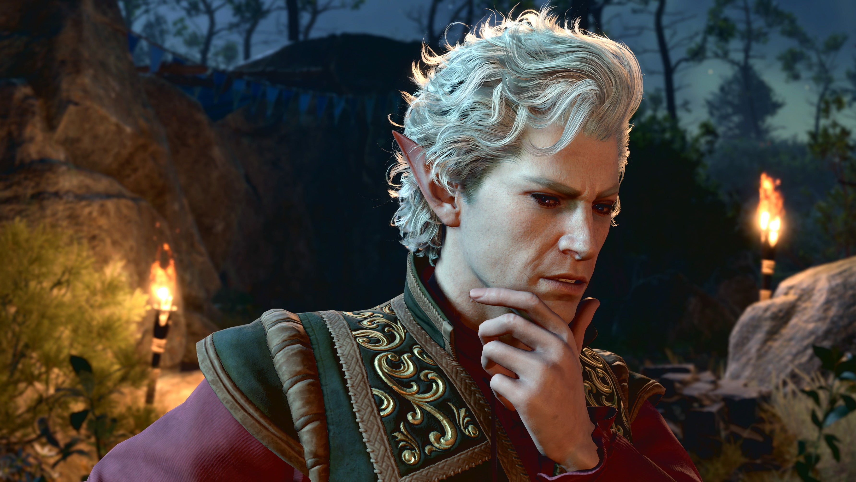 A handsome man with short, curly, grey hair, holding his chin, lost in thought. He has long, pointed ears. It&rsquo;s Astarion from Baldur&rsquo;s Gate 3.