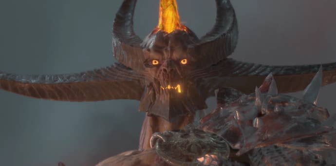 A firey, horned demon with glowing eyes stares slightly off-screen