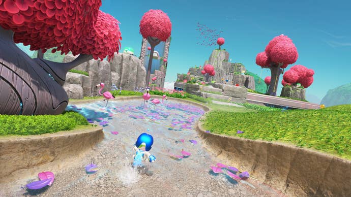 astro bot in pond with flamingos