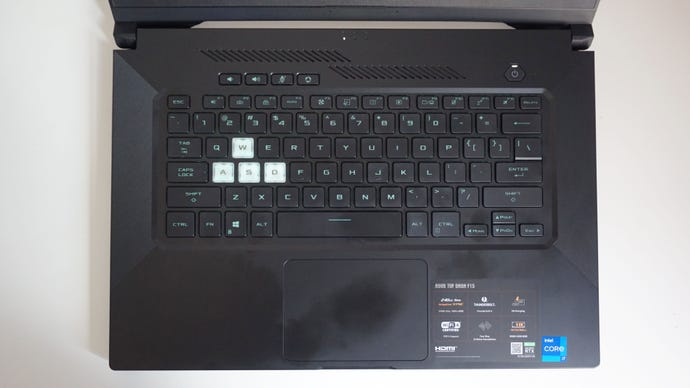A photo of the Asus TUF Dash 15 gaming laptop’s keyboard on a white desk