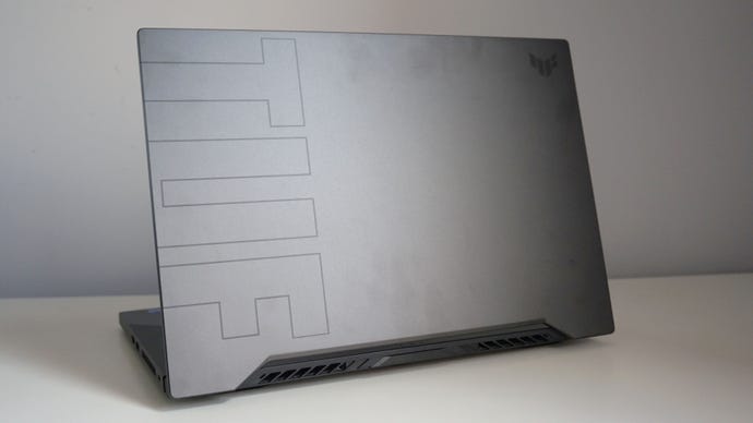 A photo of the Asus TUF Dash 15 gaming laptop’s lid on a white desk