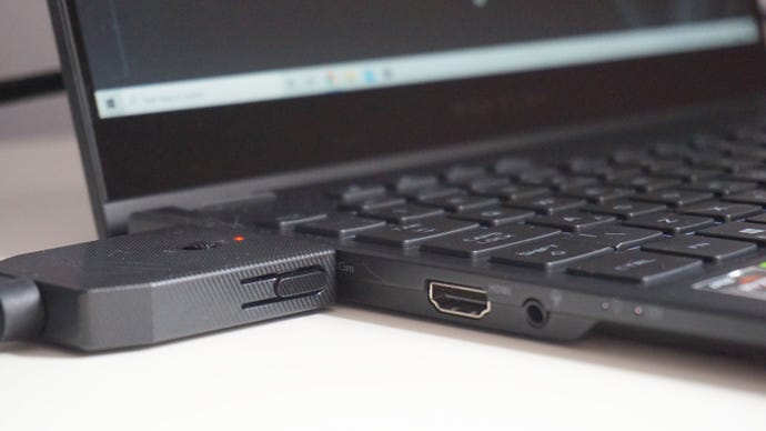 A close-up of the Asus ROG Flow X13 gaming laptop connected to the XG Mobile eGPU