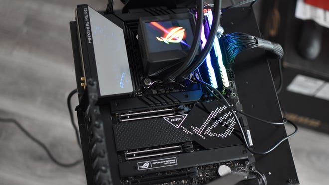 An Asus ROG Maximus Z3690 motherboard with RAM, CPU and cooler installed.