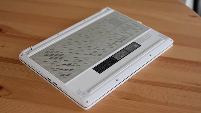 The Asus ROG Zephyrus G14 gaming laptop sitting upside-down on a table.