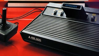 An Atari 2600 console with an Asteroids cart inserted in a screenshot from the Atari 50 collection