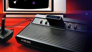 A screenshot showing an Atari 2600 with an Asteroid cartridge inserted, connected to a joystick and TV.