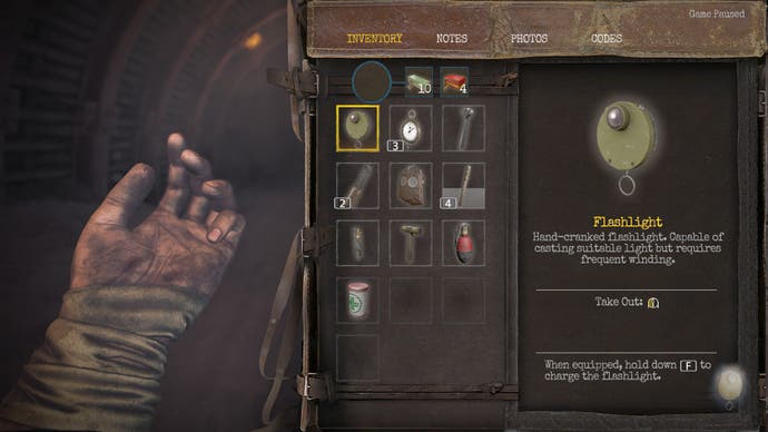Amnesia: The Bunker review screenshot, showing an inventory screen with an assortment of tools and healing items for use. The hand on the left-hand side intimates the soldier is currently unwounded.