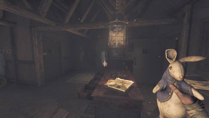 Amnesia: The Bunker review screenshot shows Henri in the “safe” administration room, looking at the lit lantern and clutching a toy rabbit.