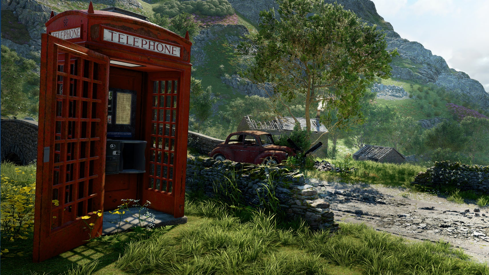 A red phone box in a hilly, green Lake District setting with old drystone walls