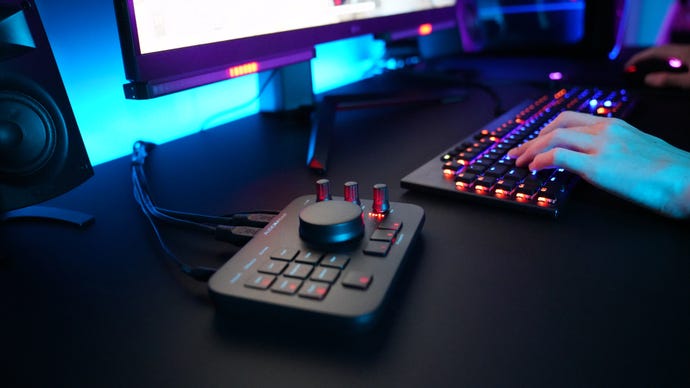 The Audio Radar control hub on a desk, next to a gaming keyboard.