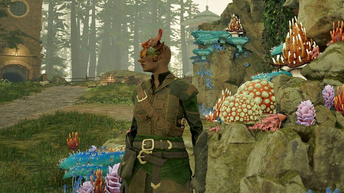 The Envoy of Avowed, wearing leather armour with a striking fungal growth coming out of her hand, stands in front of a rock decorated with other multicoloured mushrooms.