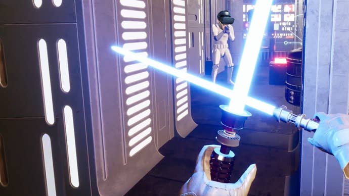 A screen shot of the Star Wars Jedi Knight 2 VR Remaster demo taken from the first person perspective of someone holding two lightsabers. A Storm Trooper is in the background with Ian’s head super imposed onto its body.