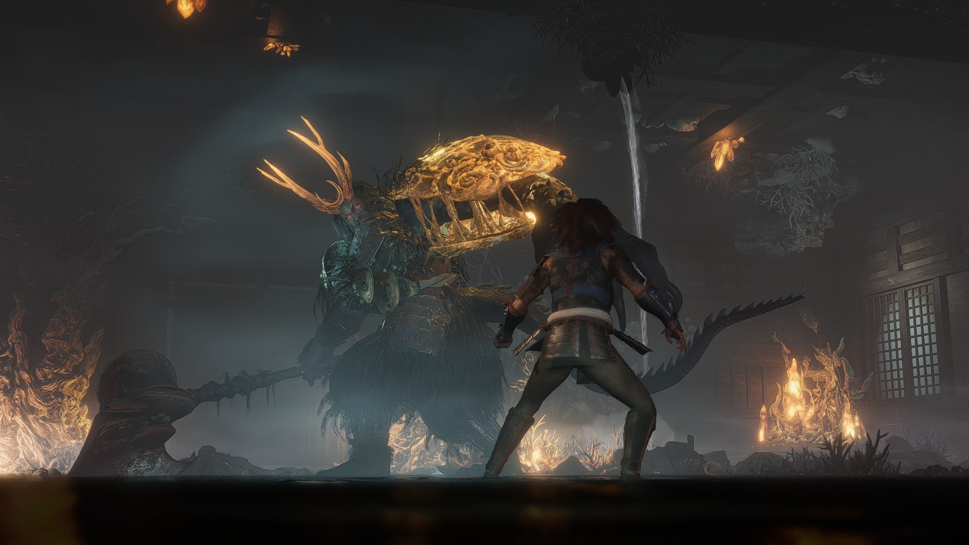 Takechiyo, protagonist of Nioh 3, looks up at Baba Nobuhara, a looming, monstrous boss.