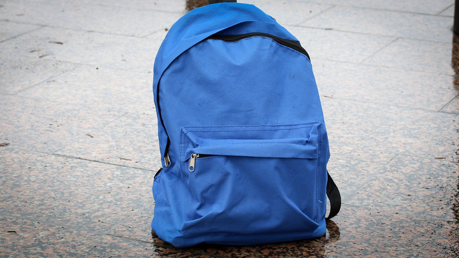 A lost backpack symbolizing the theft of personal items and handheld consoles