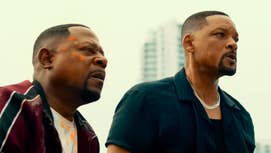 Bad Boys 4 still showing Martin Lawrence and Will Smith stood on a building, both with a stressed expression on their faces.