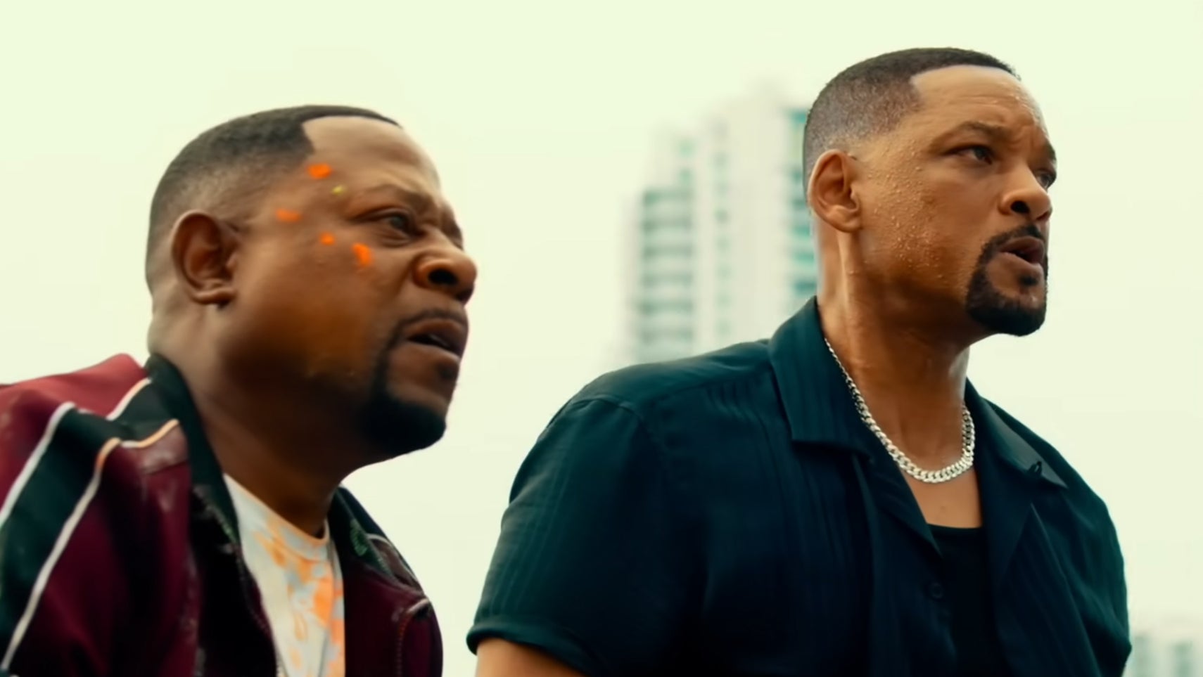 Bad Boys 4 still showing Martin Lawrence and Will Smith stood on a building, both with a stressed expression on their faces. - 1
