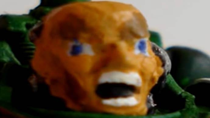 A terrifyingly painted space marine model.