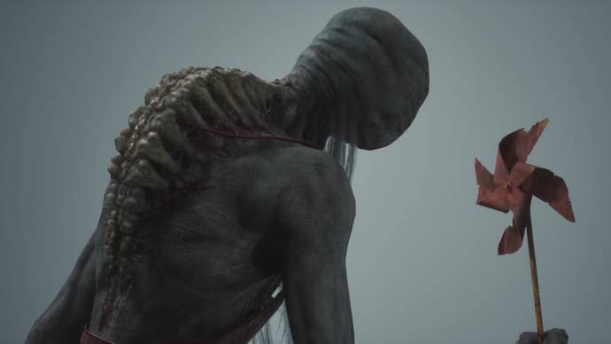 The Wuchang Fallen Feathers boss Bai Kru - a hunched, ghoulish figure - holds a red pinwheel.