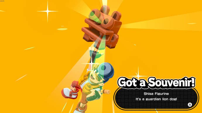 Getting a lion dog souvenir in Bakeru.