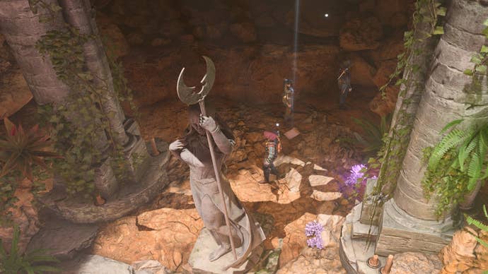 Baldur’s Gate 3 Owlbear cave chest: A man in a poofy hat is standing in the sunlight behind a large statue of a woman holding a staff