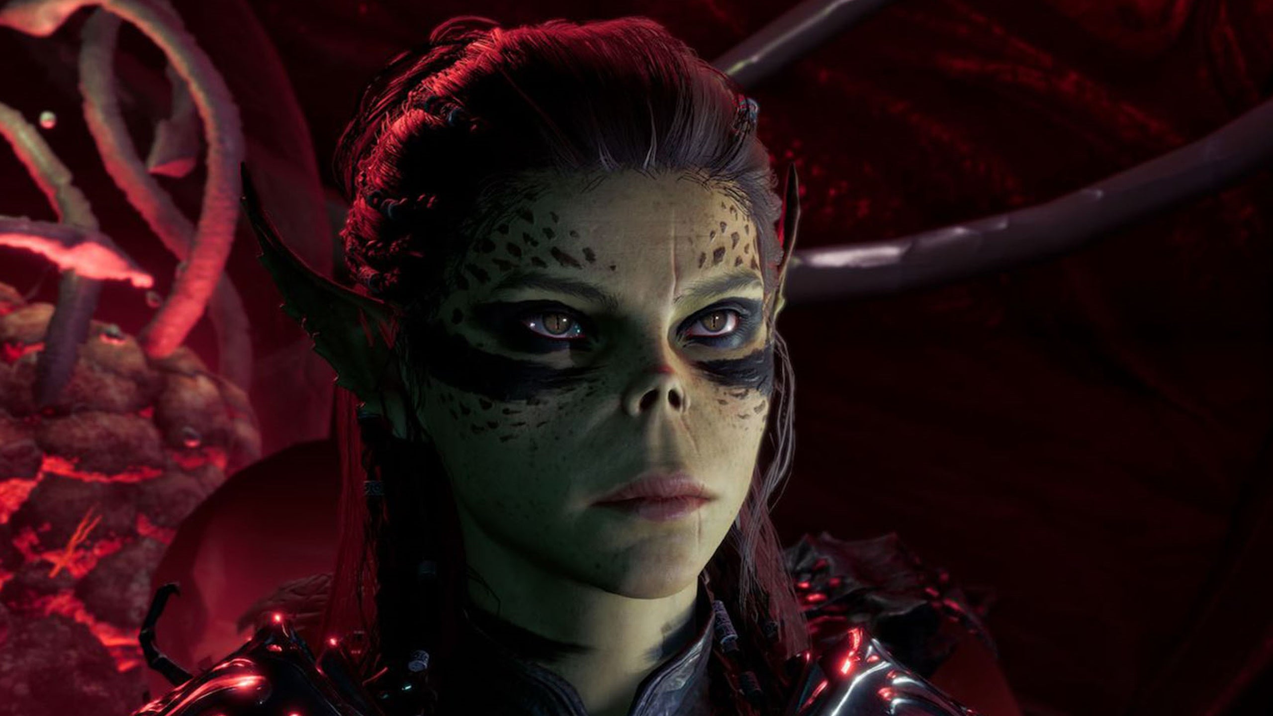 Baldur&rsquo;s Gate 3 party composition: A reptilian woman with painted eyes and red lips is standing in front of a mass of tentacles